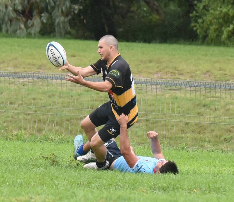 Banovich gets this offload away for one of Pirates multiple tries in their trial against Dubbo.