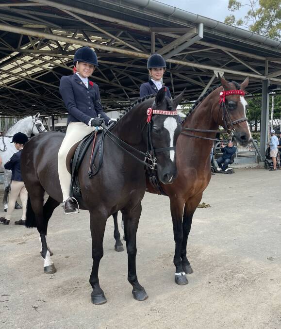 Bridie with sister Allie before their girl rider class at the Sydney Royal Easter Show.