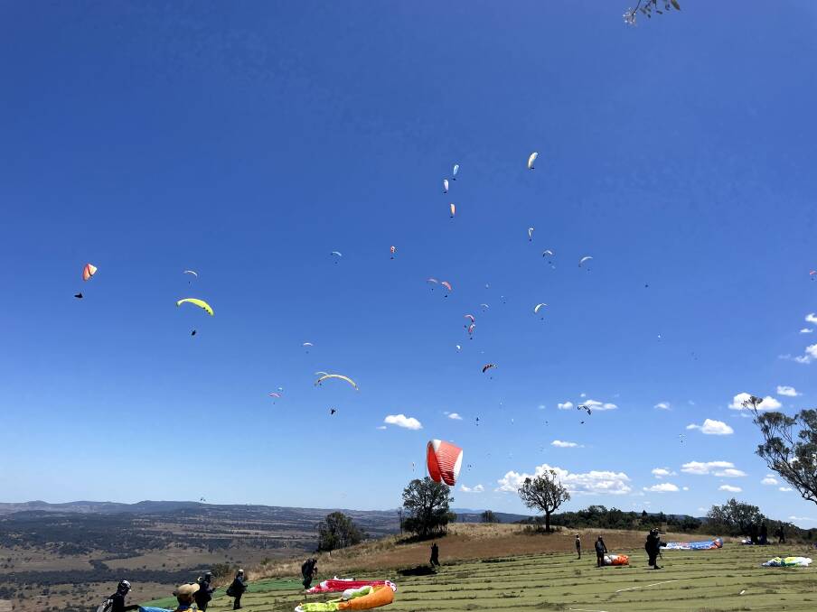 Pilots make for a patchwork of colour as they take to the skies for the final day. Picture Manilla Paragliding