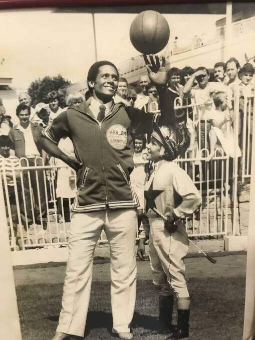 'A chip of the old block': Braith's father Greg with one of the Harlem Globetrotters during an Australian visiti.