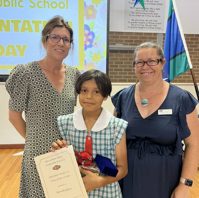 Knox receives her Premiers Sporting Challenge Award at the Hillvue presentation day. Picture Hillvue Public School Facebook