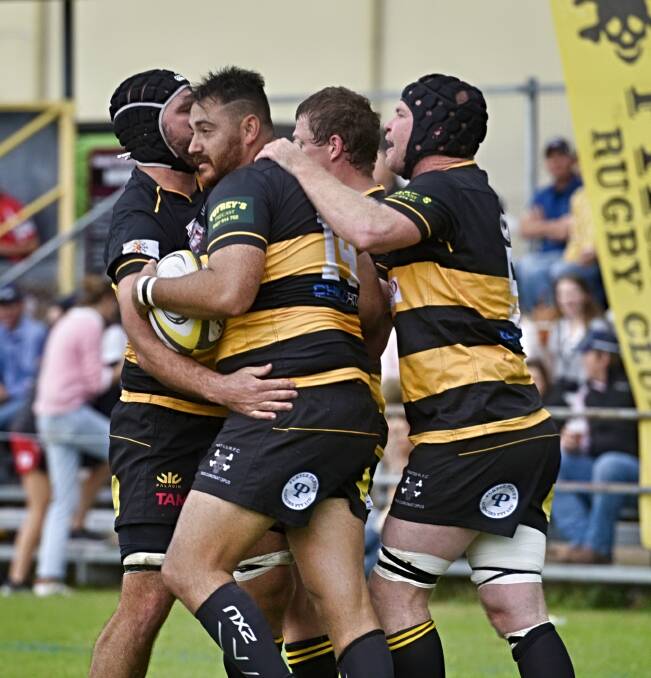 Pirates gather around Shaquille Ervine after scoring his second try in their win over Quirindi. Picture by Mark Bode