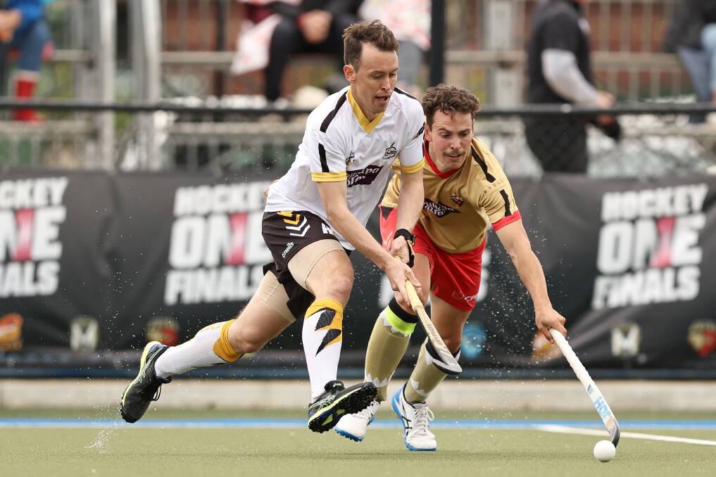 Matt Willis competes for possession with NSW Pride captain Jack Hayes during Sunday's Hockey One grand final. Picture by Martin Keep/Getty Images