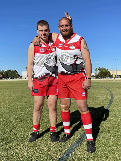 Thomas with dad Josh after playing their first game together last year. 