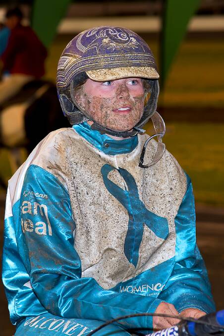 Double delight: Jemma Coney's teal silks needed a little "soak" after Saturday night's meeting. But it was a good night for the 19-year old, driving a double. Photo: PeterMac Phtography
