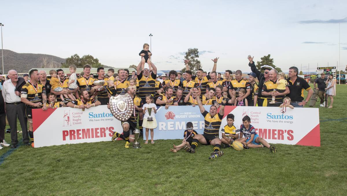 Triumphant: Pirates celebrate a third straight first grade premiership after beating Walcha 24-8 on Saturday. Photo: Peter Hardin
