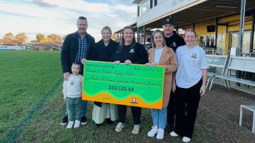 Pirates president Maryjane Gavin and the Trappel family, April, Simon and Millie, present Phelan-McDermid Syndrome Foundation Australia, co-director Megan Toole, husband Andrew and son Jack, with the proceeds from their Family Fun Day.