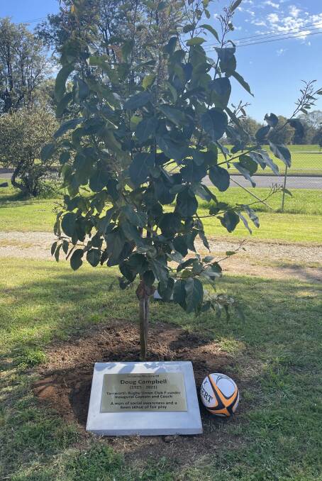 The plinth and plaque, which reads: 'In Loving Memory of Doug Campbell (1925-2021). Tamworth Rugby Union Club founder inaugural coach and captain. A man of social awareness and a keen sense of fair play.'