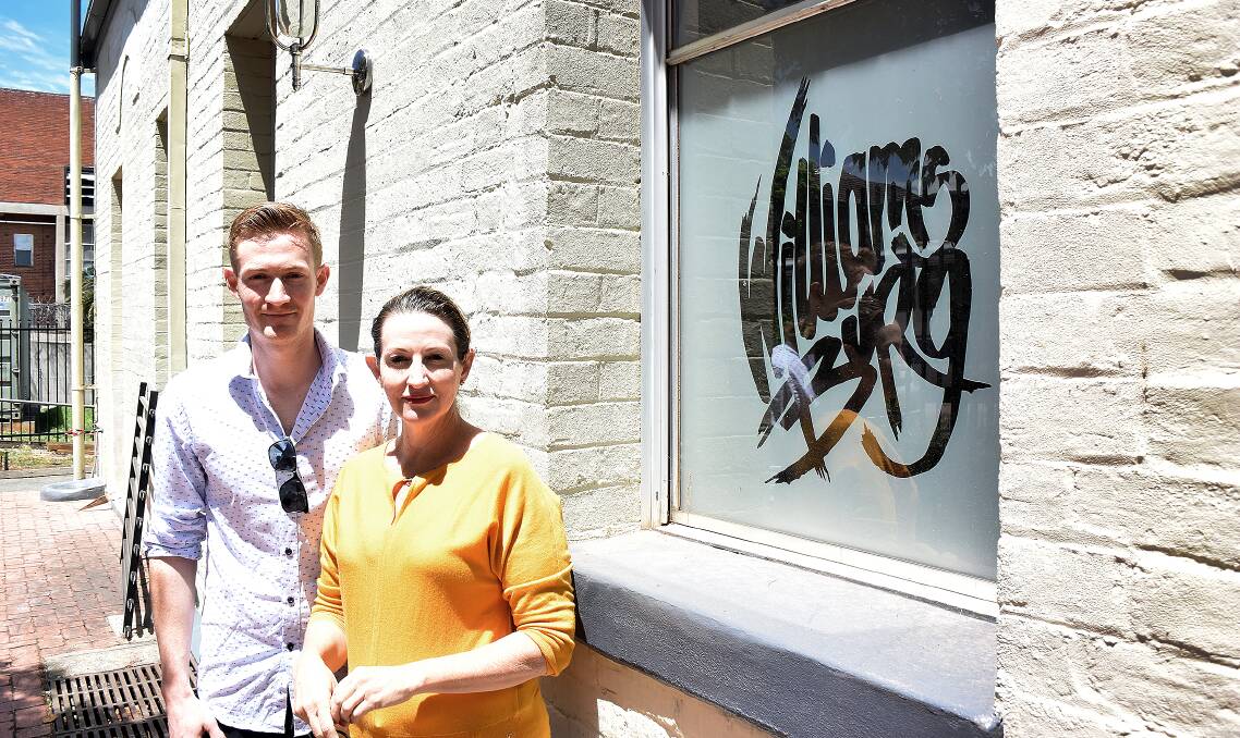 TAMWORTH'S TUCKING IN: Luke Fielding, pictured here with mother Sally, and father Darren, are the faces behind the new burger joint, Williamsburg, in the old Mechanic's Institute building on Brisbane St. Photo: Jacob McArthur