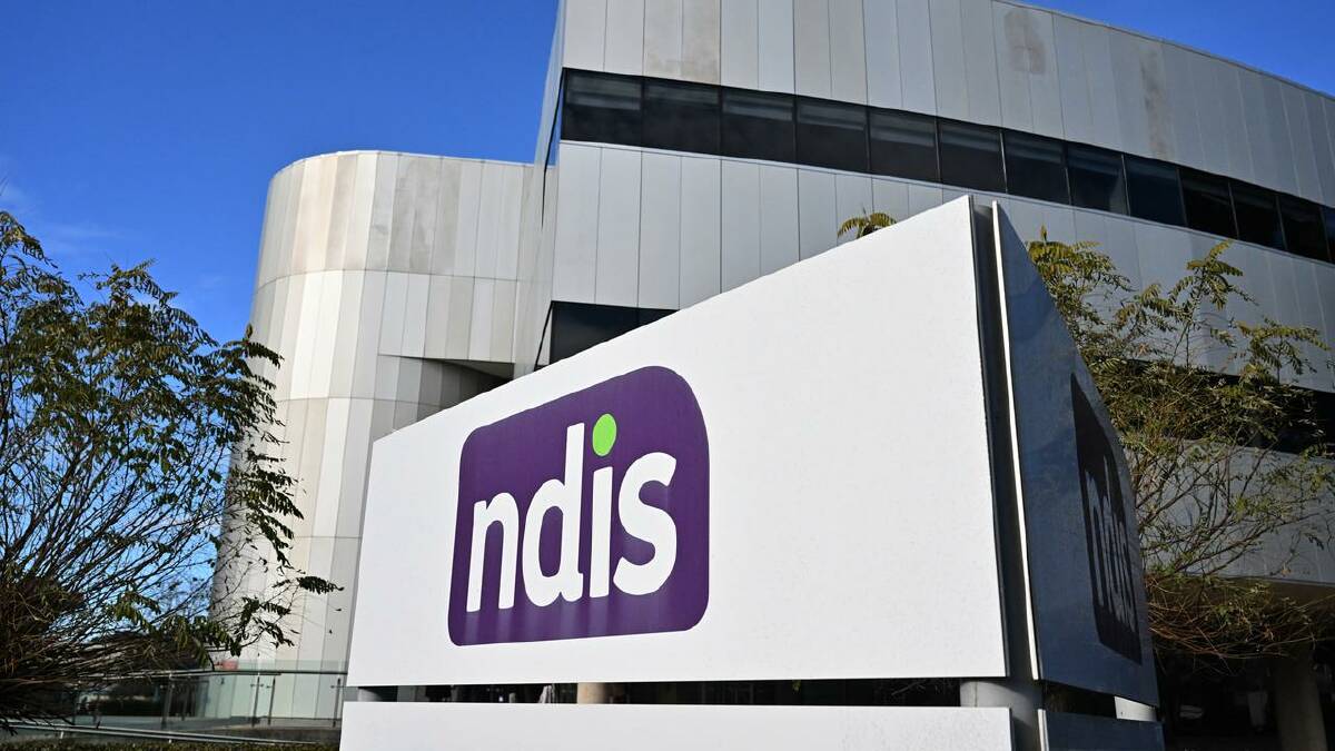 Unions say NDIS providers should classify staff under support services rather than as carers. (Mick Tsikas/AAP PHOTOS)