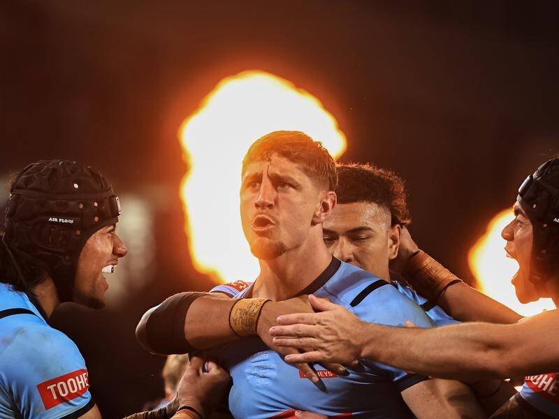 NSW debutant Zac Lomax (c) was the Blues' best player and also scored a brilliant try. (Mark Evans/AAP PHOTOS)