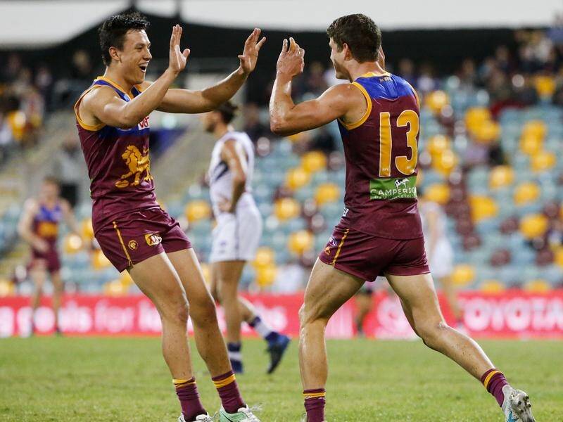 Free agents Hugh McCluggage (l) and Jarrod Berry (r) are expected to sign with Brisbane again. (Glenn Hunt/AAP PHOTOS)