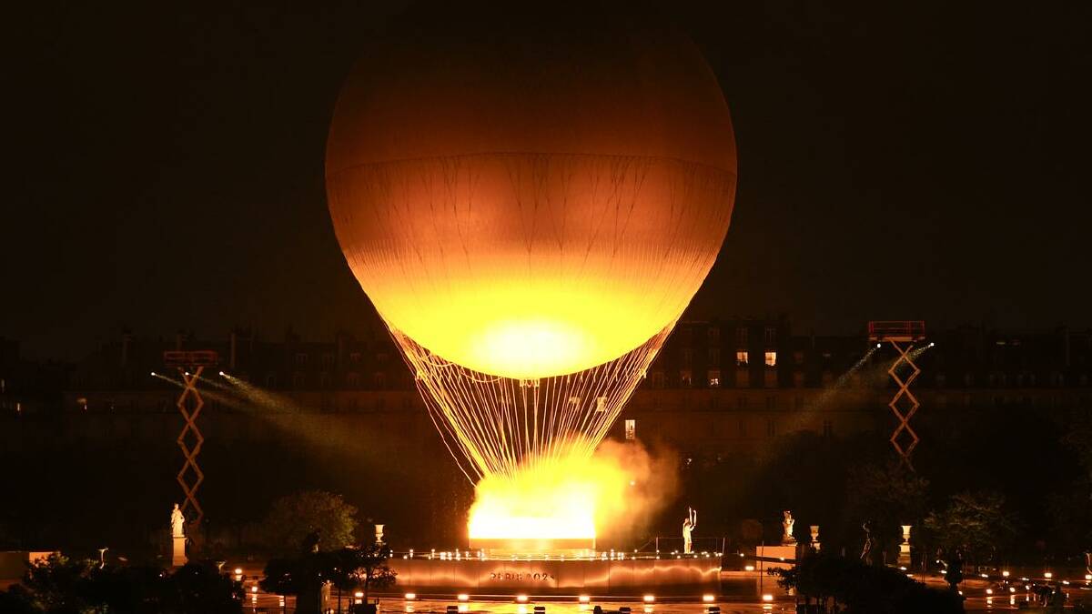 The Olympic Flame rose on a balloon after being lit during the Paris Games opening ceremony. (AP PHOTO)
