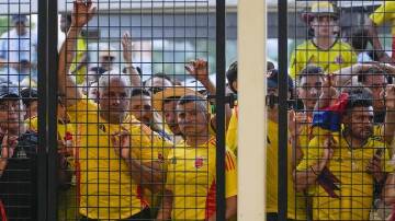The disorder around the Copa America final led police to lock stadium gates leaving fans outside. (AP PHOTO)