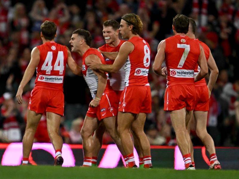 Sydney have swamped Geelong at the SCG, with Tom Papley (second left) kicking four late goals. (Dean Lewins/AAP PHOTOS)
