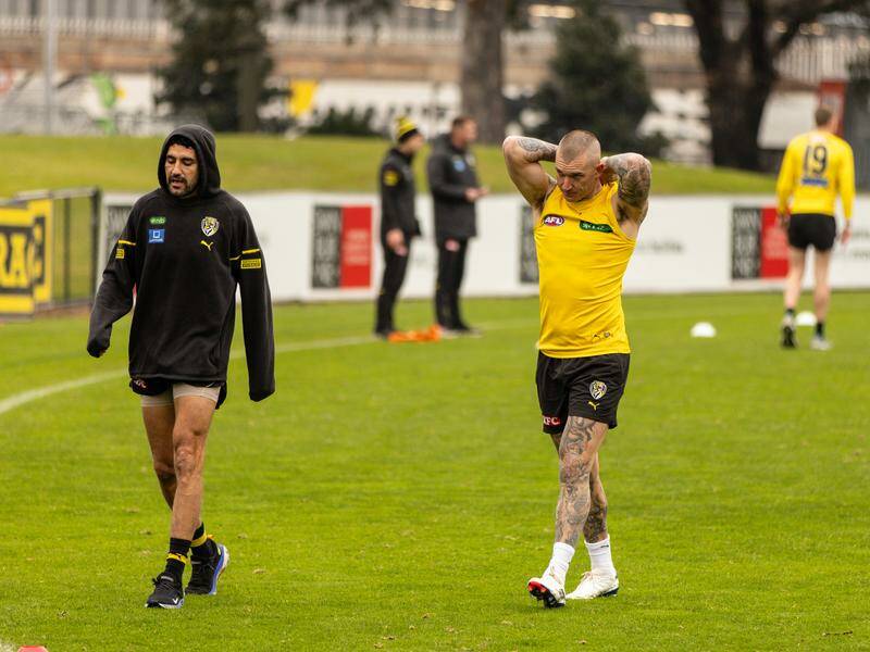 Dustin Martin continues to be hampered by a back injury. Photo: Diego Fedele/AAP PHOTOS