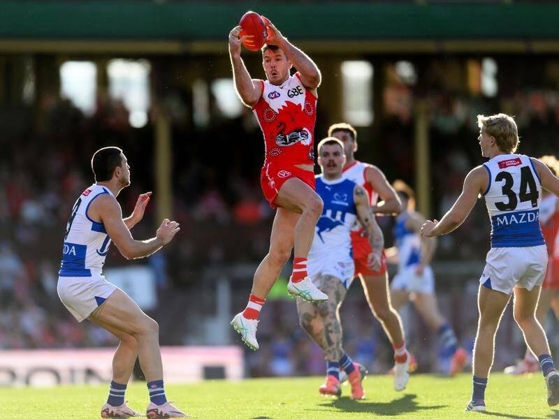 Luke Parker flies high against North to mark in his Swans return after injury and suspension. (Steven Markham/AAP PHOTOS)