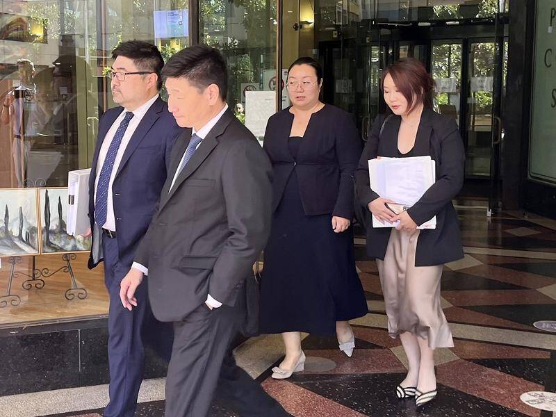 Jie Shao (second from right) pleaded not guilty to manslaughter over a breast augmentation death. (Duncan Murray/AAP PHOTOS)