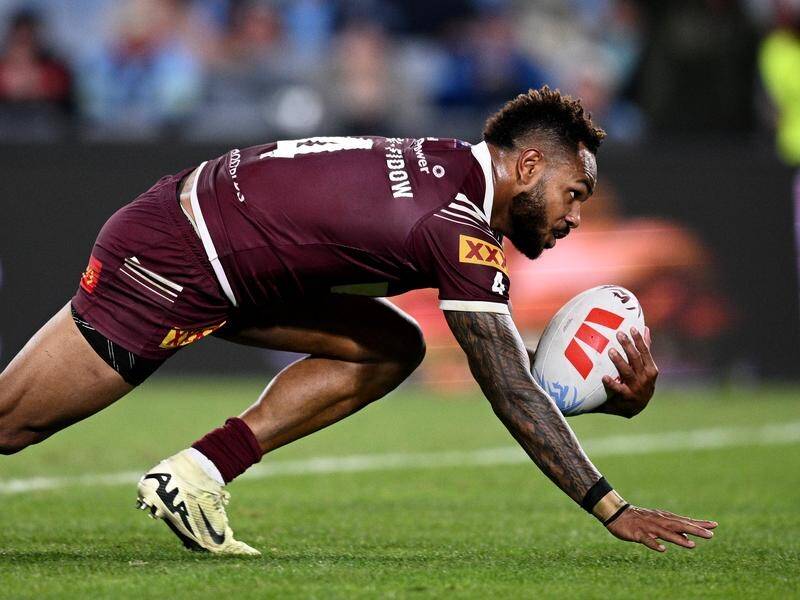 Queensland flyer Hamiso Tabuai-Fidow scored a hat-trick in the 38-10 win over NSW. (Dan Himbrechts/AAP PHOTOS)