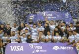Argentina's rugby team celebrate with the trophy after defeating France in Buenos Aires. (AP PHOTO)
