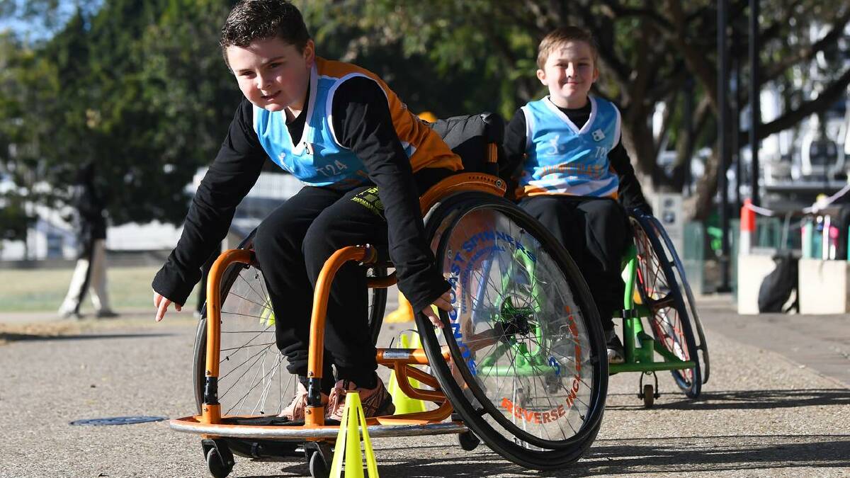 Wheelchair basketball players Kayden and Ryley Wakeham showed their skills at Tuesday's event. (Jono Searle/AAP PHOTOS)