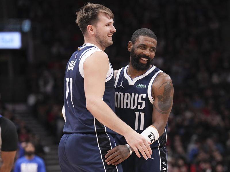 Luka Doncic and Kyrie Irving have combined for 59 points in Dallas's 136-125 NBA win in Toronto. (AP PHOTO)