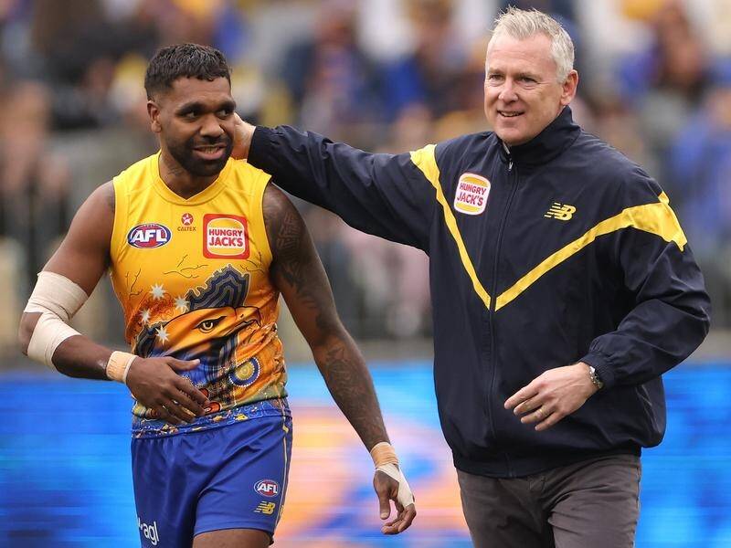 Ex-Eagles coach Adam Simpson and Liam Ryan share a moment before the clash with Brisbane. (Richard Wainwright/AAP PHOTOS)