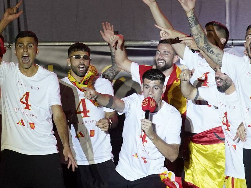 Alvaro Morata (on the mic) led the 'Gibraltar is Spanish' chants at the team's Euros victory parade. Photo: AP PHOTO