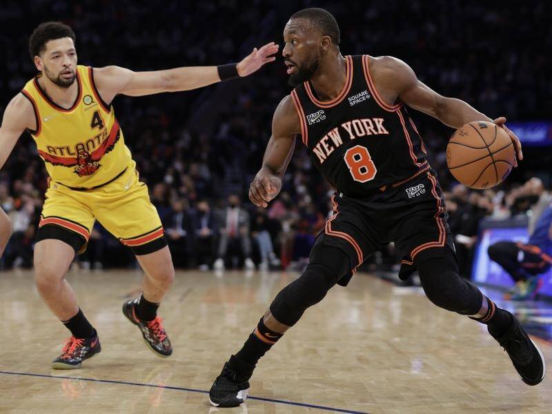 Kemba Walker (8) drives against Atlanta Hawks' Skylar Mays during his stint with New York Knicks. (AP PHOTO)