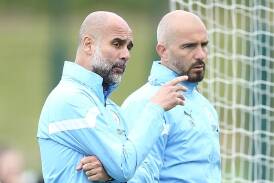 Pep Guardiola will face former assistant Enzo Maresca (r) in the Premier League opening round. (EPA PHOTO)