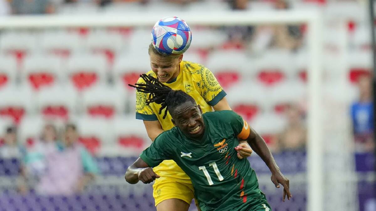 Zambia's Barbra Banda proved a handful for Aussie Clare Hunt. (AP PHOTO)