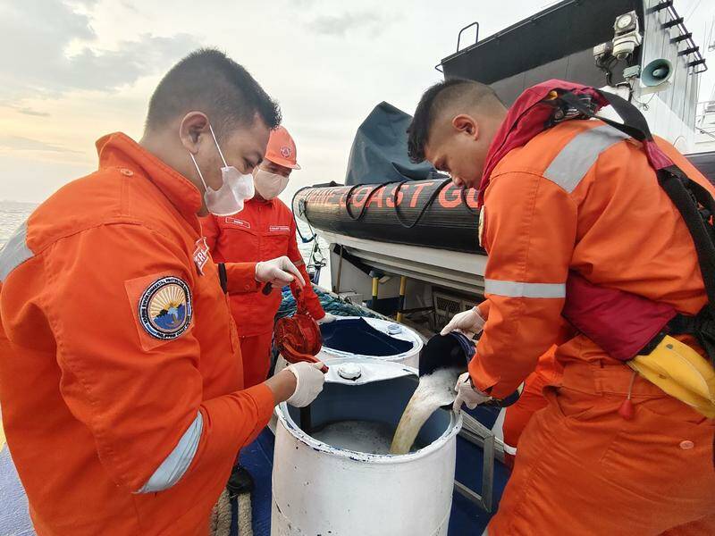 The coast guard have collected oil and seawater samples where the Terra Nova sank in Manila Bay. Photo: EPA PHOTO