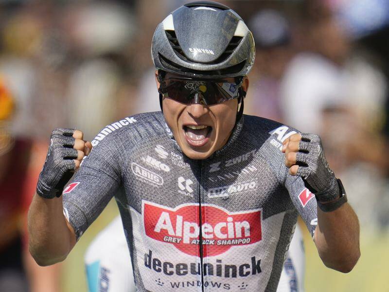 Jasper Philipsen celebrates as he finishes first to win the 16th stage of the Tour de France. Photo: AP PHOTO