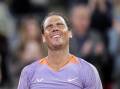 Rafael Nadal was the picture of delight after his revenge win over Alex de Minaur in Madrid. (AP PHOTO)