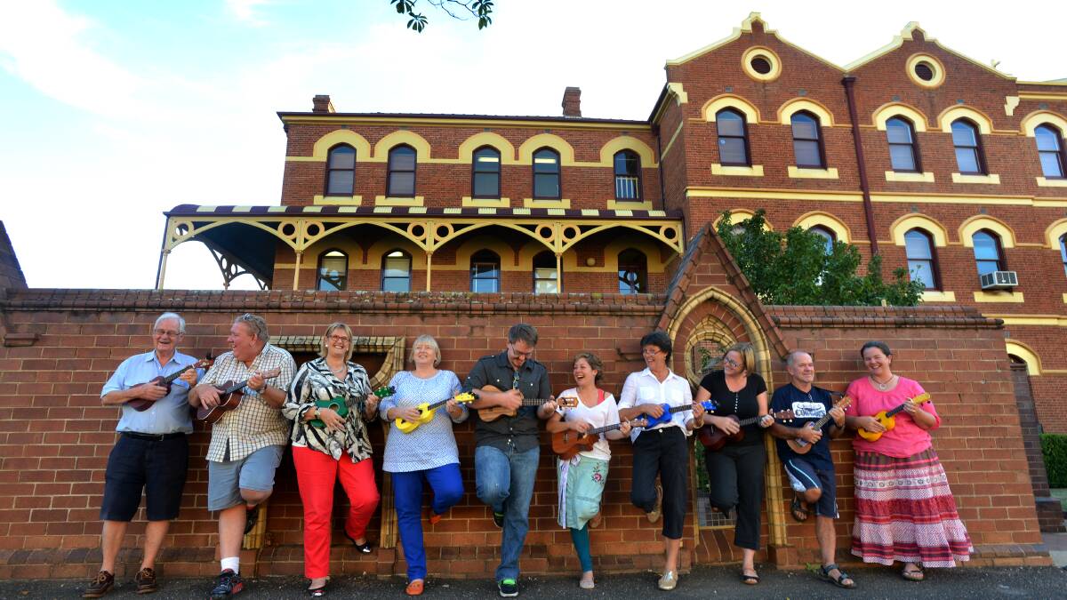 The Tamworth Ukulele Group at the front of the Tamworth Regional Conservatorium of Music in April. Photo: Barry Smith 020414BSG02