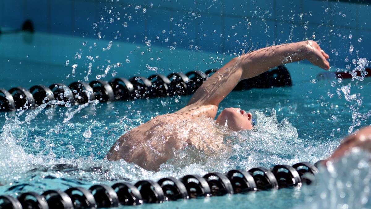 Hugh Wolfgang swims the 50m boys backstroke event at Tamworth in December. Photo:Barry Smith 011213BSC02