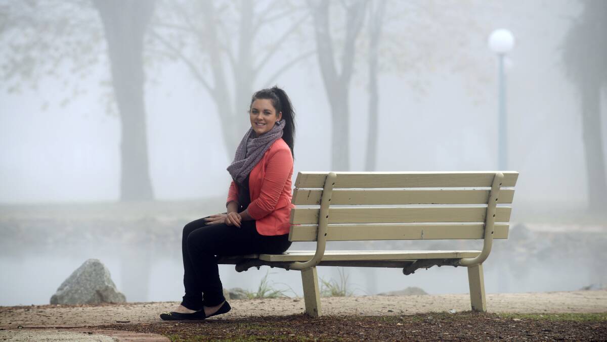 Cherkira Rogers relaxes in the park on a foggy morning in June before heading off to work. Photo:Barry Smith 170613BSA35
