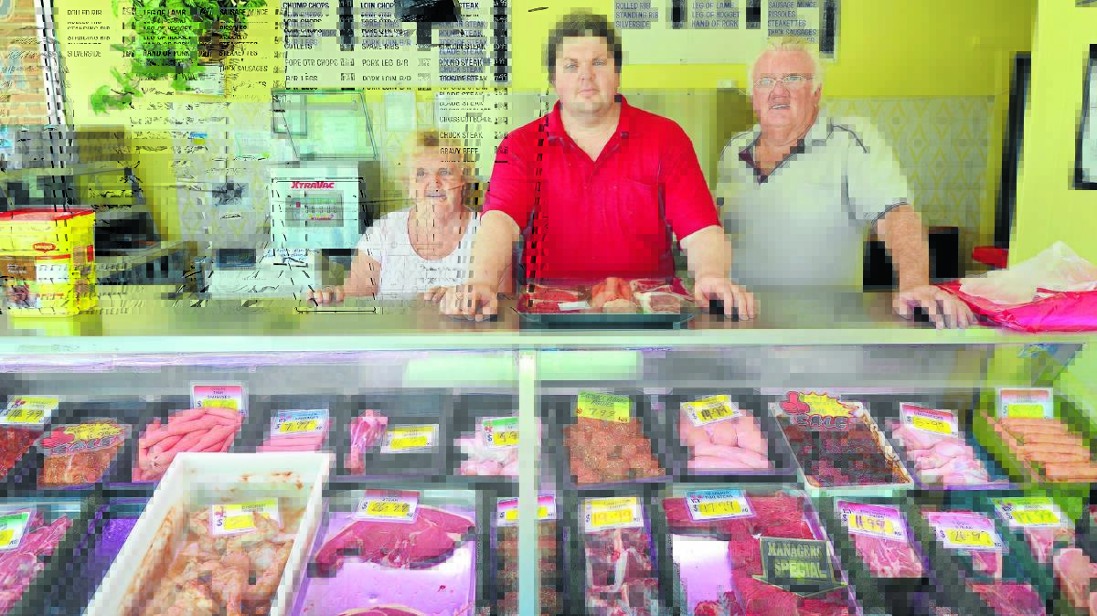 MEAT MOVES: The last butcher shop in Werris Creek will close, bringing to an end a long line of family business links for Lorraine, Mark, and Neville Woolfe in the town. Photo: Barry Smith 261115BSA01
