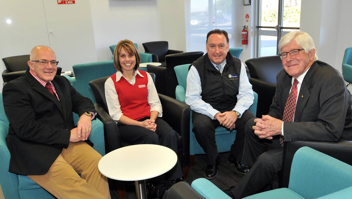 ENJOYING THE FACILITIES: Tamworth Business Chamber president Tim Coates, Travelworld's Renetta Coutman, Harvey World Travel's Philip Lyon and Tamworth regional councillor Warren Woodley get comfortable in the new surrounds. Photo: Geoff O’Neill 110713GOA10