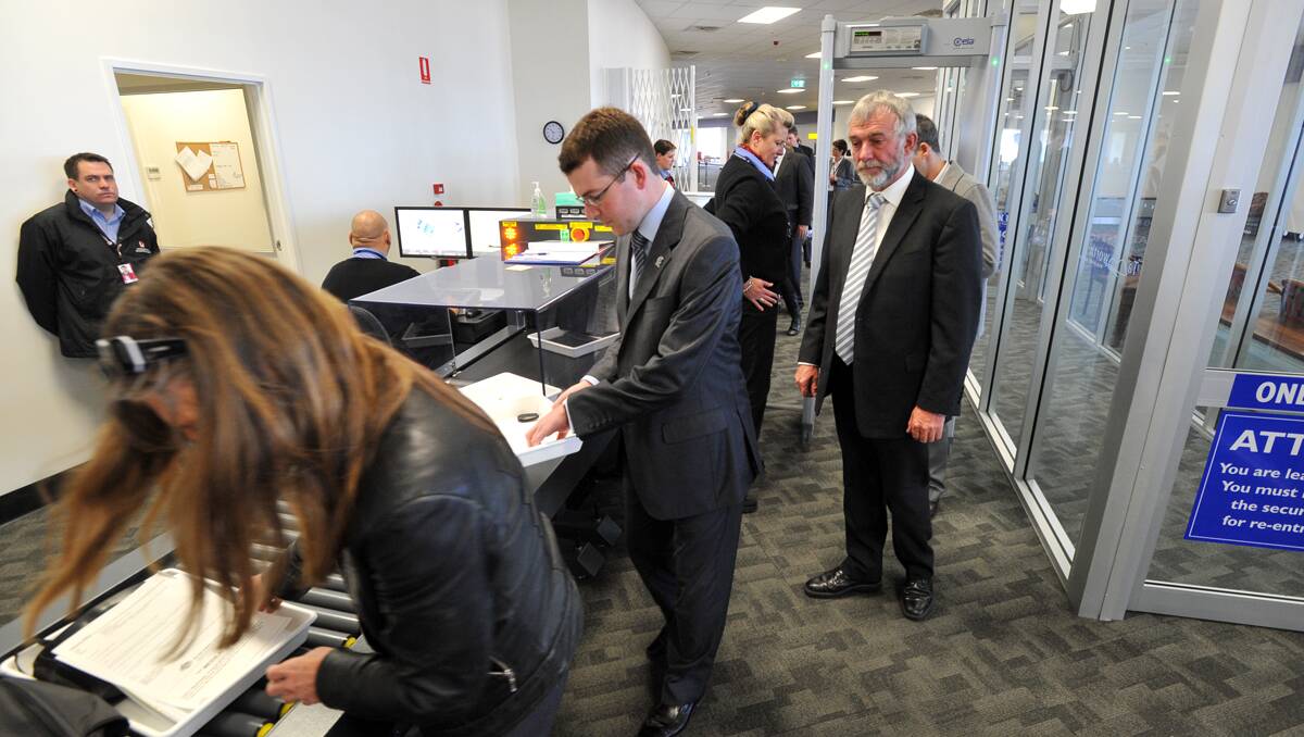 "Noone put the gloves on": Gunnedah Mayor Adam Marshall is put through the strict new security measures at Tamworth Regional Airport which was officially opened this morning. Photo: Barry Smith
