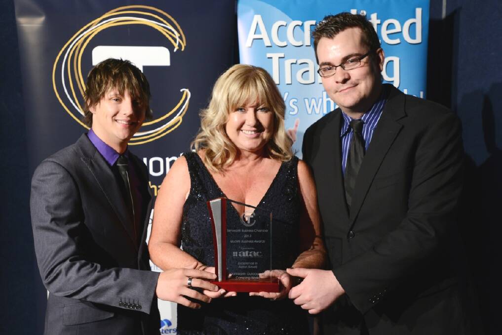 Luke Anderson and Josh Allan of Optus present Lisa Ashcroft with the award for Small Retail. She's accepting the award on behalf of Geoff and Jenny Taylor of Tamworth Outdoor and Camping World. 